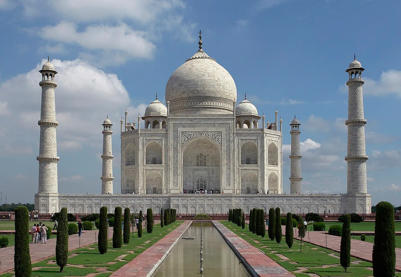 The Taj Mahal in white marble, viewed down its central reflecting pool