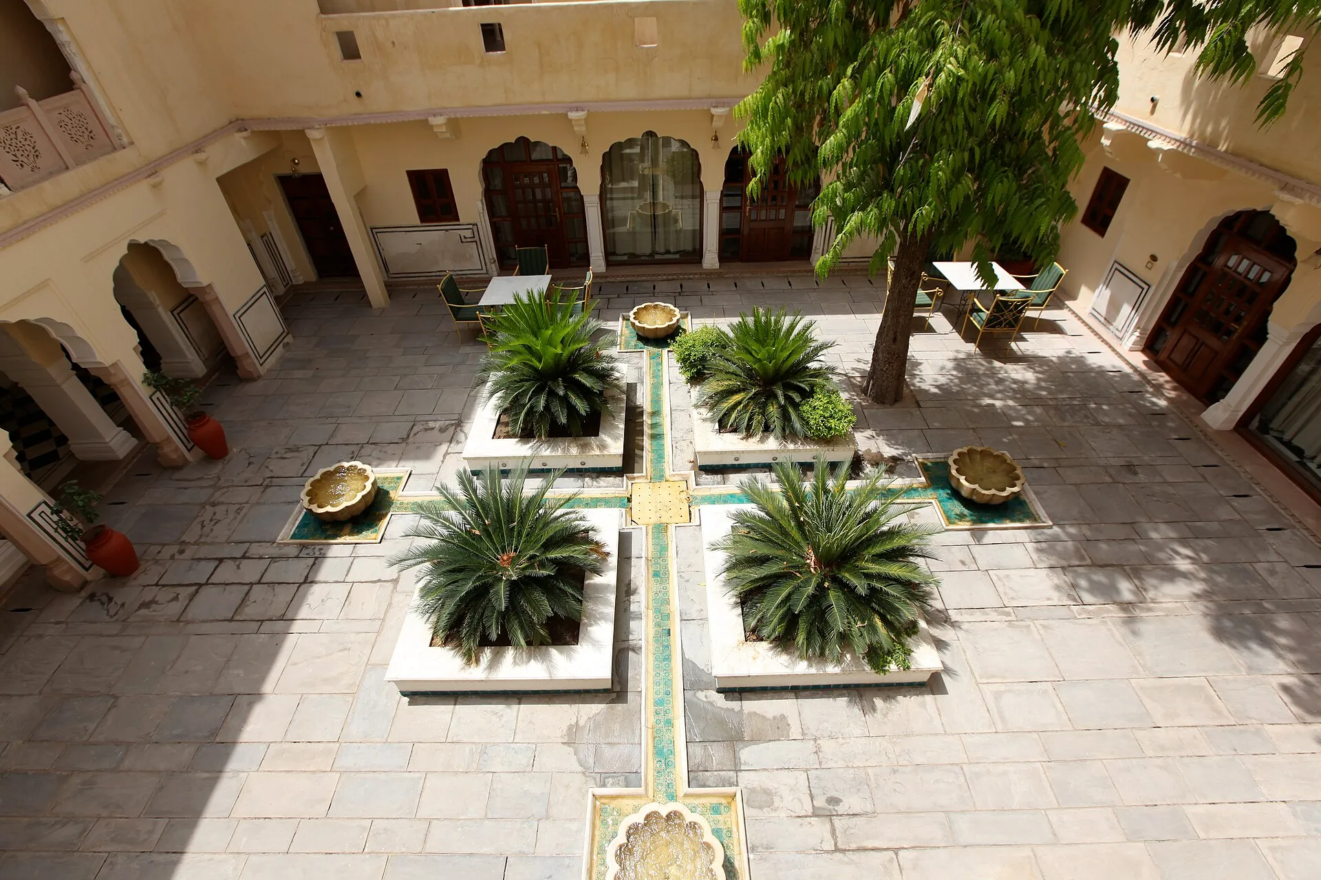 An ornate royal estate courtyard and garden