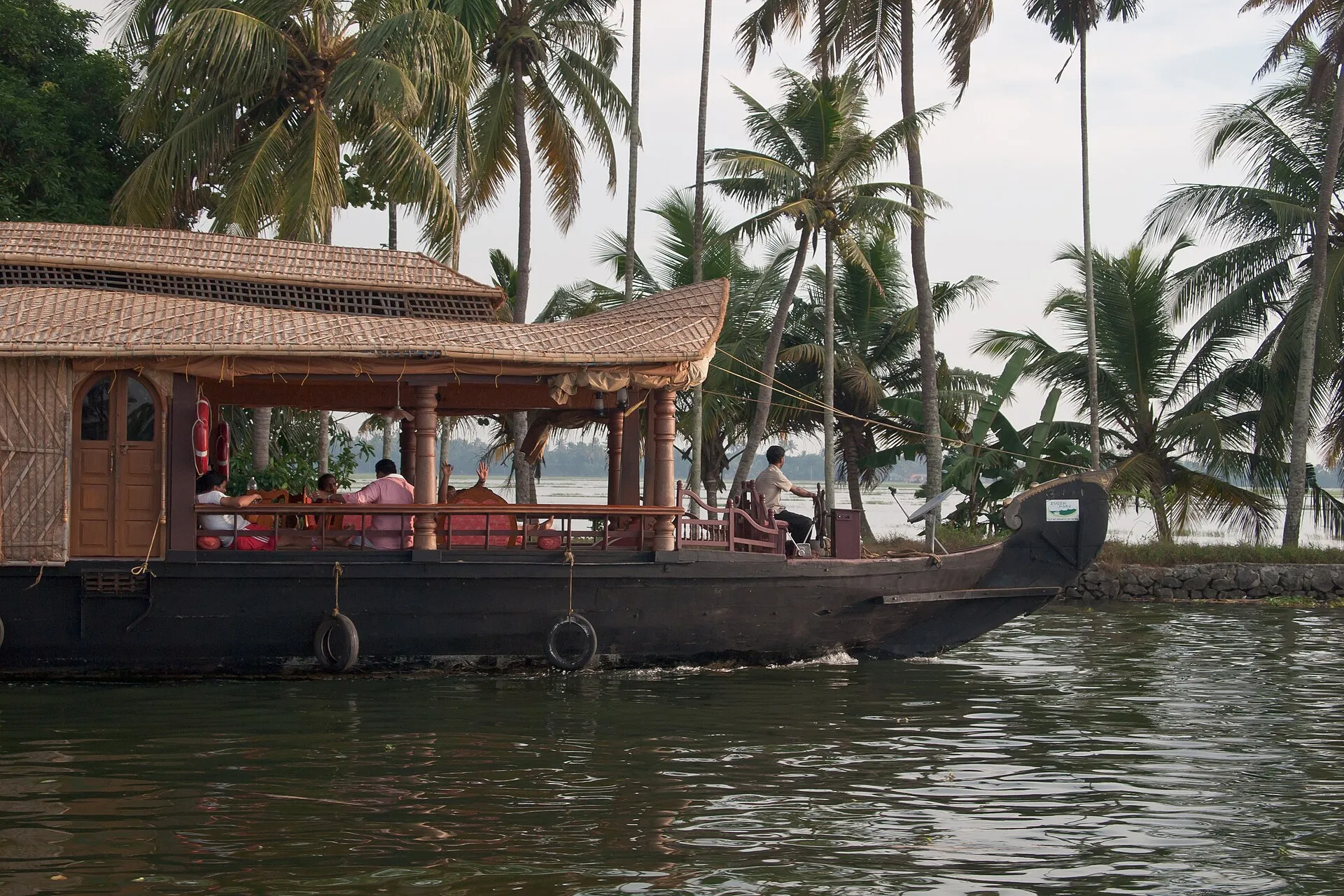 A traditional Kerala houseboat on palm-lined backwaters