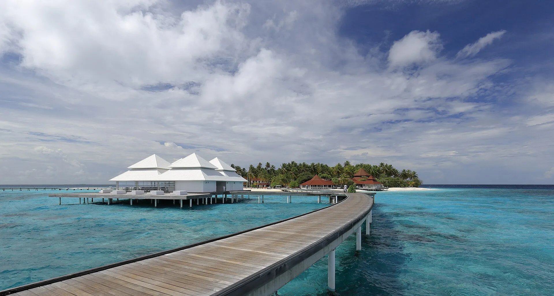 Overwater villas above a turquoise Maldivian lagoon