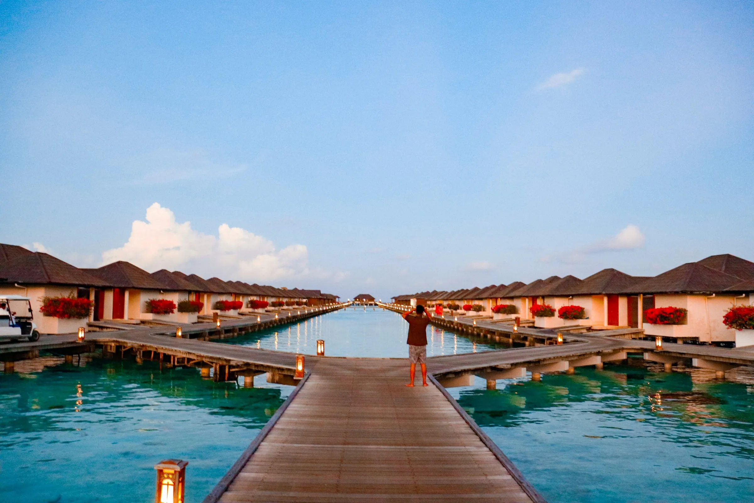 Overwater villas above a turquoise Maldivian lagoon