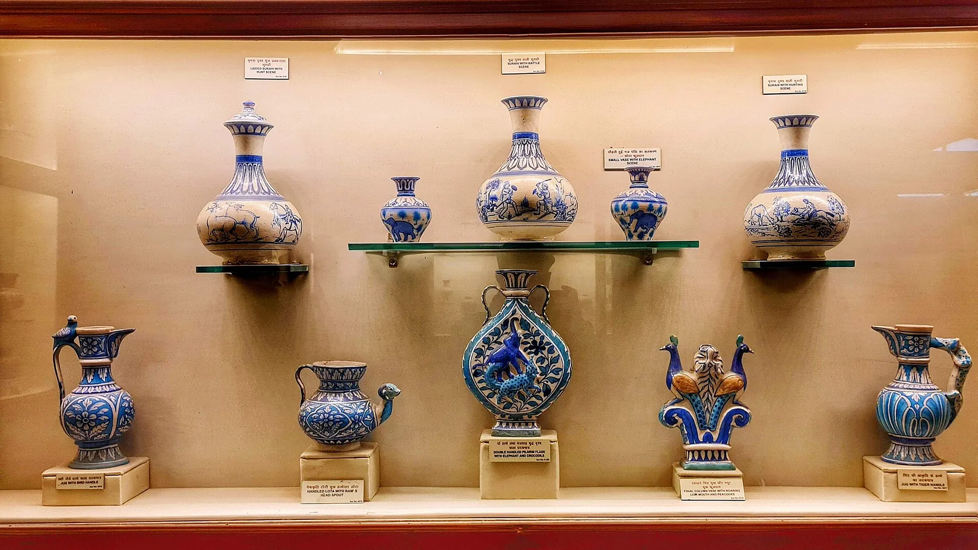 A display of Jaipur blue pottery in cobalt and turquoise glazes