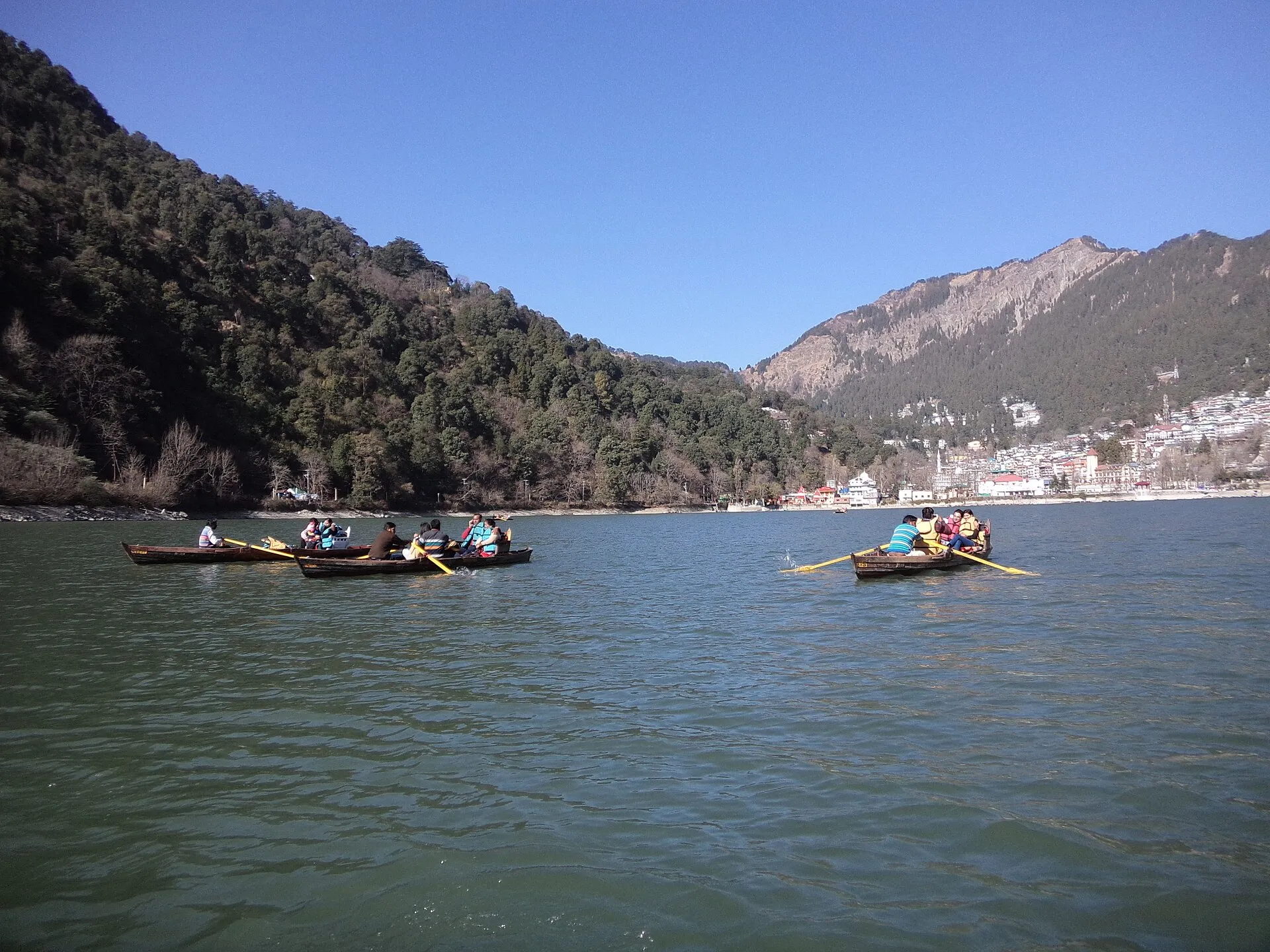 Nainital lake ringed by forested hills in the Himalayan foothills of Uttarakhand